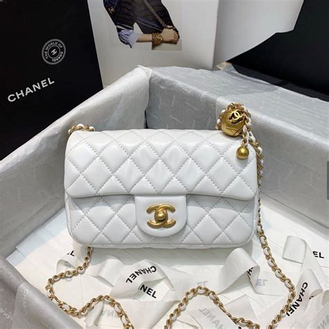 white chanel purse with black c|chanel 22 white bag.